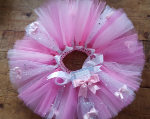 pink and white tutu on a wooden background