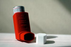 a red asthma inhaler