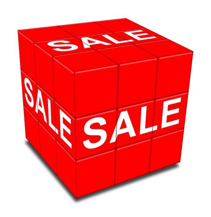 A red cube with the words sale in white