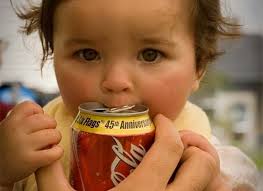baby drinking a can of coke