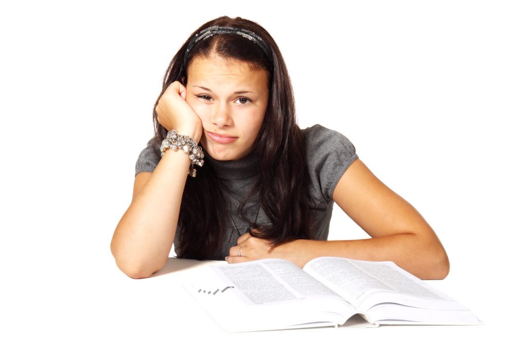 woman stressed ad bored with books