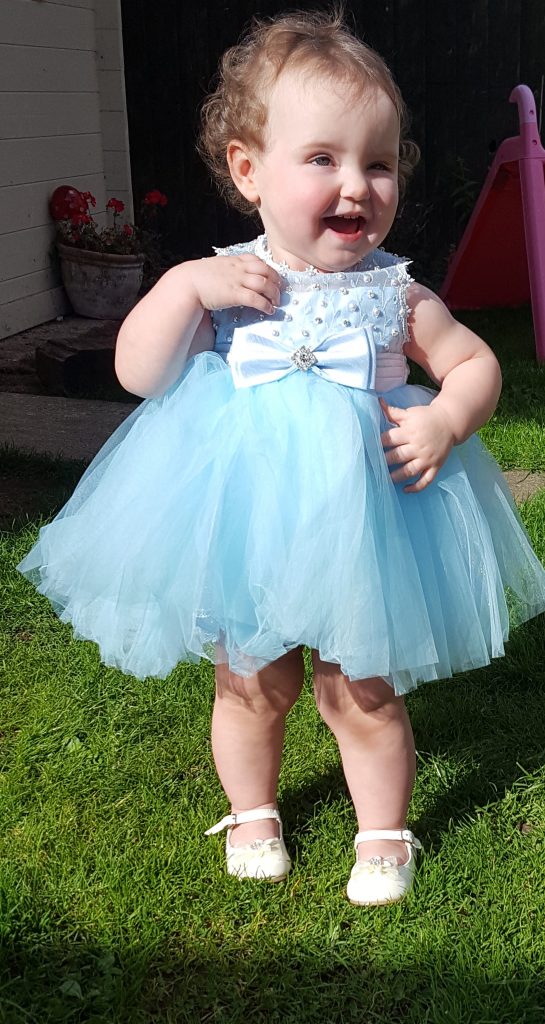 Alyssa posing in a blue tulle dress