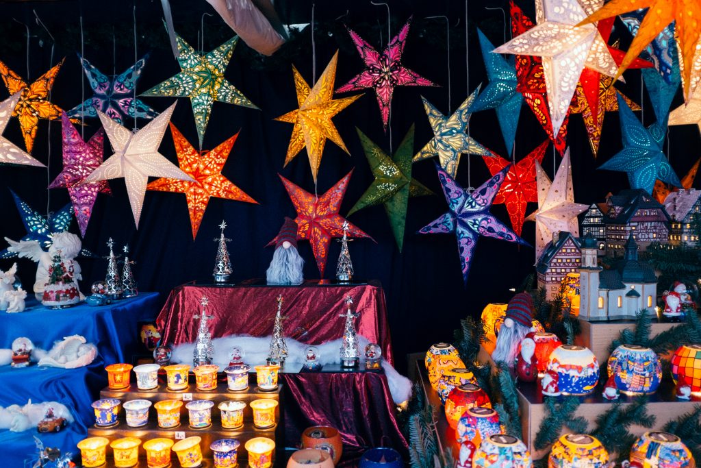 lots of different multicoloured christmas decorations and stars
