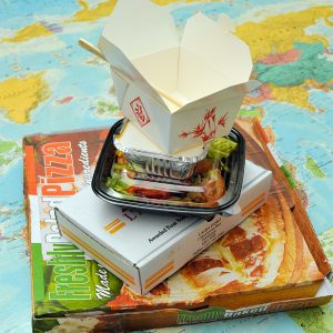 a stack of different takeaways on a map