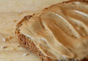 peanut butter on brown toast