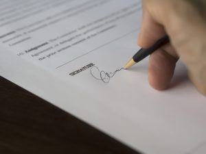 pen signing a contract