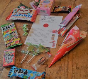 assortment of japanese snacks laid out on a table
