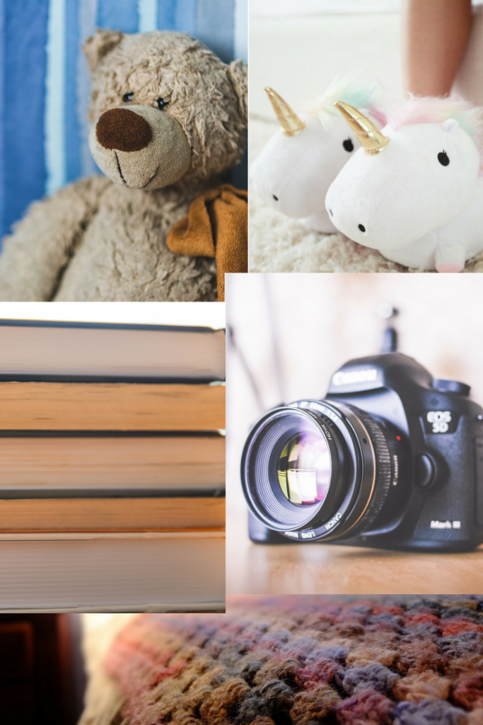 a teddy bear a canon camera a woolen blanket a pile of cooks and unicorn slippers