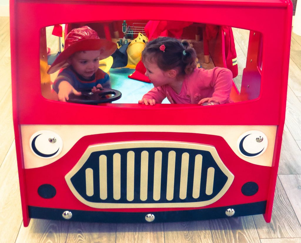 alyssa and l in red fire engine