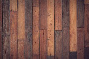 a top shot of darkish wooden floor boards