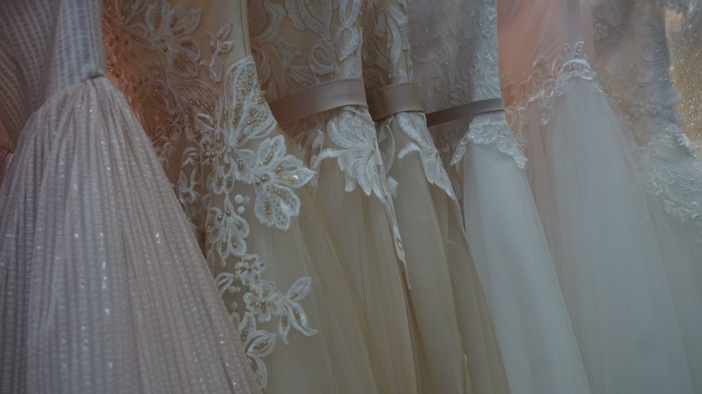 a row of bridal gowns close up