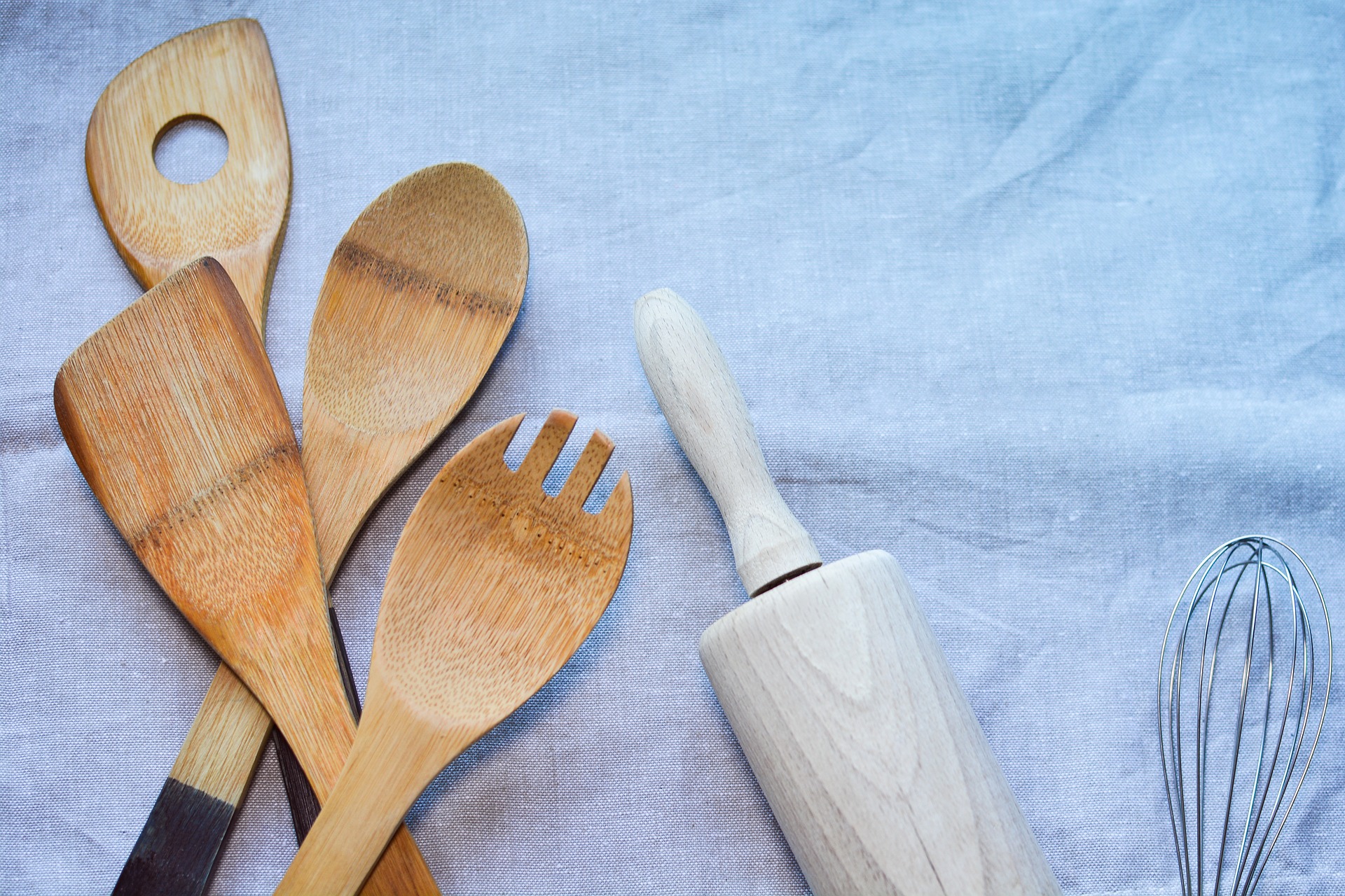 a collection of wooden kitchen utensils