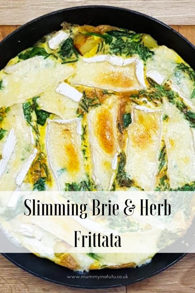 the brie and herb frittata cooked and sitting in the skillet
