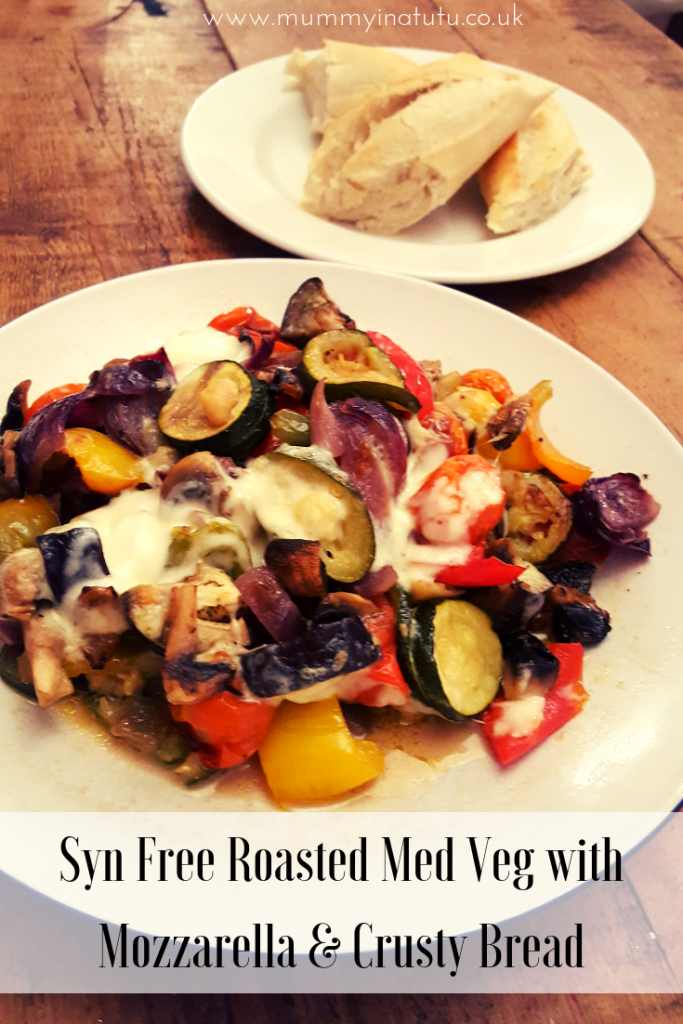 a plate of roasted med veg with mozzarella and some crusty bread