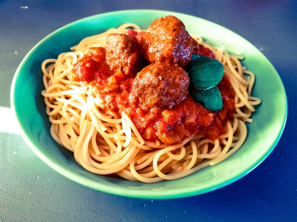 a bowl of vegetarian italian meatballs with spaghetti