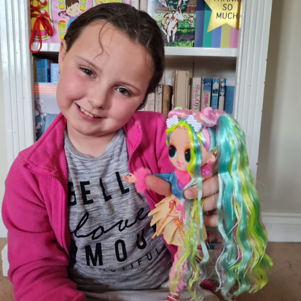 My daughter holding the L.O.L Surprise doll
